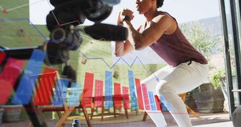 Fitness analytics: man squatting outdoors with tech overlay