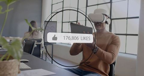 Man wearing vr headset using tablet in bright modern office showing 176,806 likes overlay
