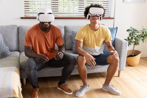 Diverse Friends Enjoying VR Gaming in Cozy Living Room