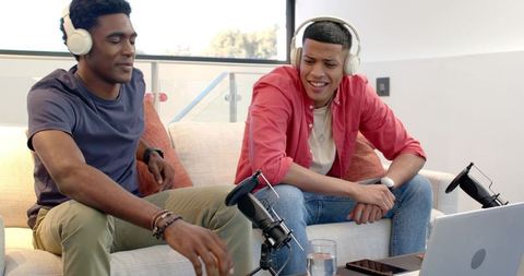 Diverse friends engaged in podcast recording session