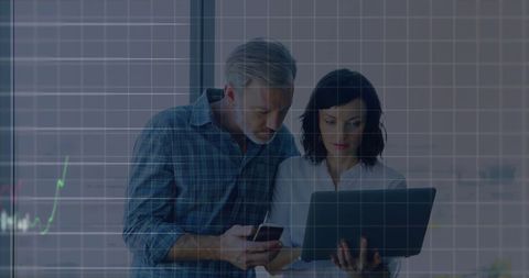 Business Professionals Analyzing Data on Breakthrough Technology