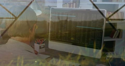 Developer typing on desktop terminal at home office desk with keyboard and monitor