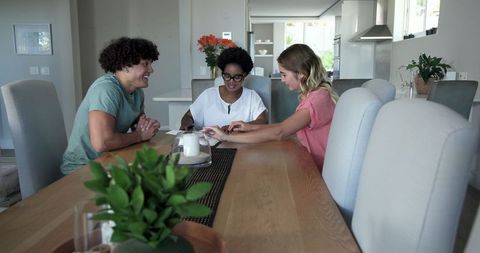 Young couple consulting with financial advisor at home