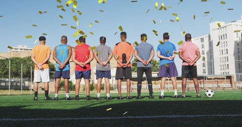 Football Team Celebrating Victory with Falling Confetti