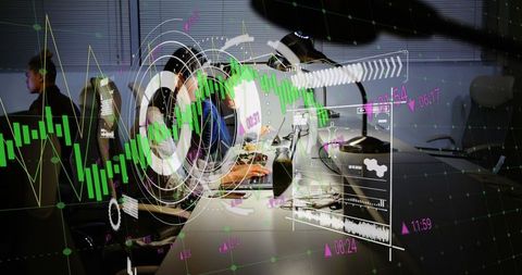 Team of Professionals Analyzing Financial Data on Laptops