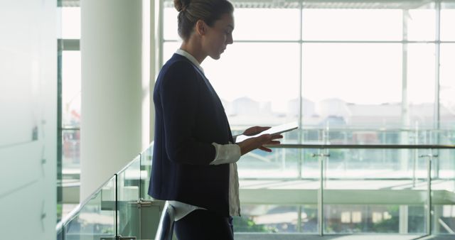 Businesswoman Networking on Digital Tablet in Modern Office - Download Free Stock Images Pikwizard.com