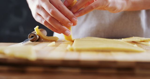 Close-Up Hands Rolling Fresh Pasta Dough on Wooden Board - Download Free Stock Images Pikwizard.com