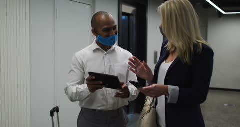 Colleagues Collaborating in Office With Face Masks During Pandemic