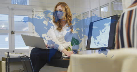 Businesswoman Analyzing Data with World Map Overlay