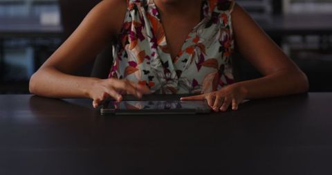 Businesswoman Using Tablet for Digital Work at Office Desk