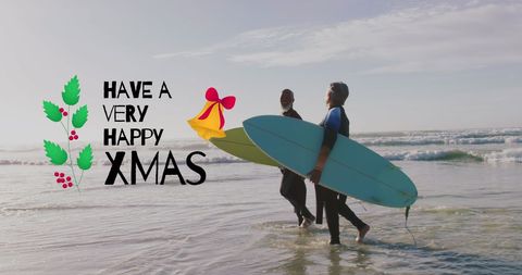 Senior Couple with Surfboards Celebrating Christmas on Beach