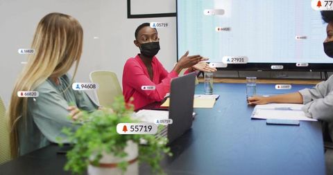 Businesswoman Presenting Data in Conference Room Setting