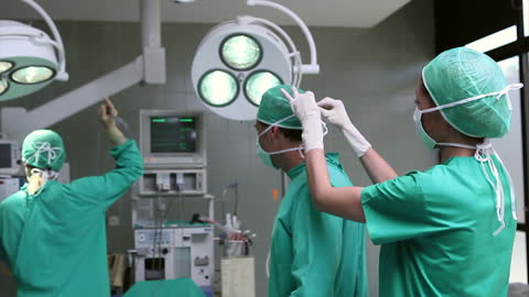 Surgical Team Prepares in Operating Room with PPE