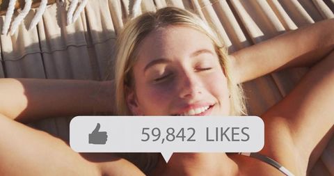 Sunlit blonde woman reclining in hammock with social likes overlay, summer lifestyle brand