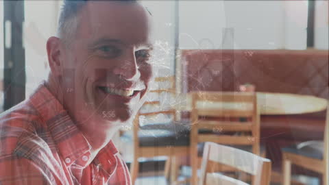 Smiling Man in Restaurant with Animated Global Financial Data Overlay