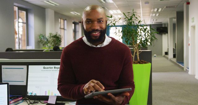 Smiling Employee Using Tablet in Modern Open Plan Office - Download Free Stock Images Pikwizard.com