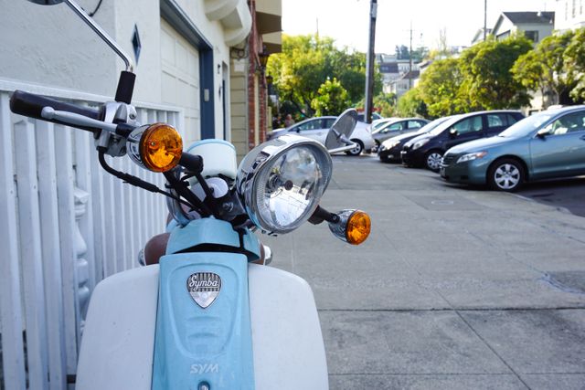 Retro Scooter Parked on Urban Street, Captures Nostalgic Urban Charm - Download Free Stock Photos Pikwizard.com
