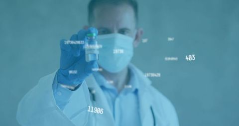 Doctor Holding Vaccine Vial with Overlay of Digital Statistics