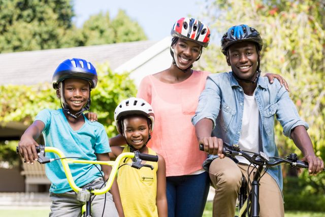 Family enjoying a sunny day in the park, posing with their bicycles. Ideal for promoting family bonding, outdoor activities, healthy lifestyle, and summer leisure. Perfect for advertisements, brochures, and websites focused on family, health, and recreation.