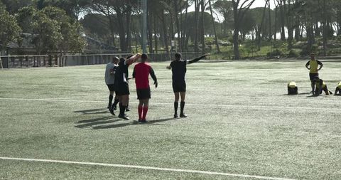 Soccer Players Considering Strategy on Outdoor Field