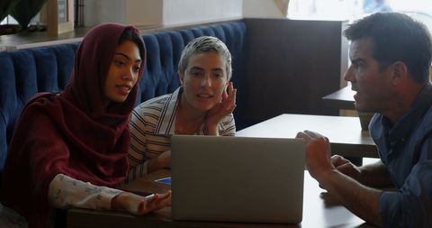 Diverse Students Collaborating on Project with Focused Teamwork