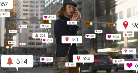 Man walking downtown using smartphone surrounded by floating social media notifications