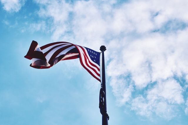 American Flag Waving Against Blue Sky with Clouds - Download Free Stock Photos Pikwizard.com
