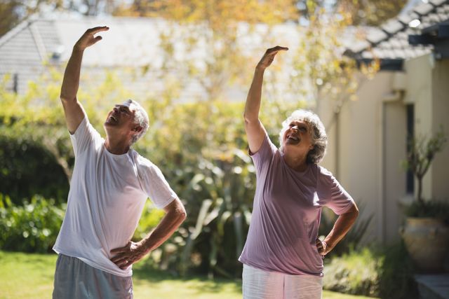 Senior couple enjoying outdoor exercise on a sunny day, promoting active and healthy lifestyle for elderly. Ideal for use in health and wellness campaigns, retirement community promotions, fitness programs for seniors, and advertisements focusing on active aging and happiness in later life.