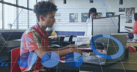 Young professional analyzing data on laptop in bright shared office with analytics overlay