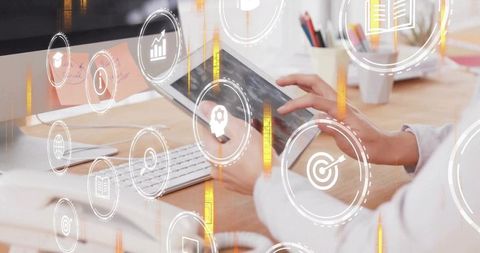 Tablet interaction with digital data icons in modern workspace