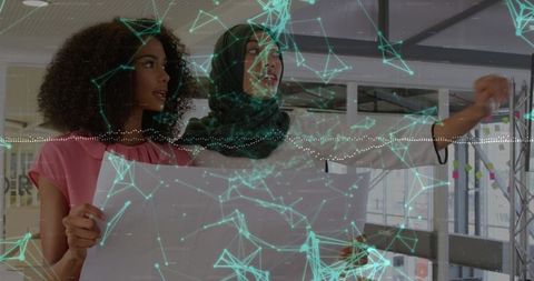 Architects Collaborate in High-Tech Studio with Blueprint and Projections