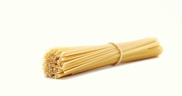 Bundle of Uncooked Spaghetti on White Background - Download Free Stock Images Pikwizard.com