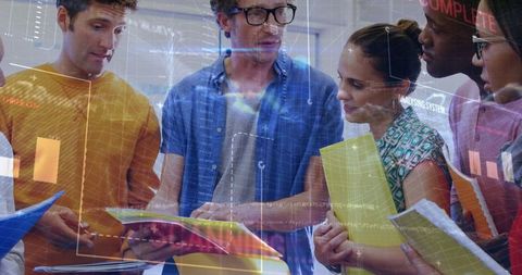 Diverse Business Team Analyzing Statistical Data Overlay