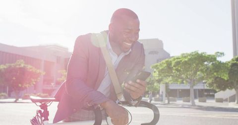 Urban Commuter's Digital Life: Joyful Cyclist Using Smartphone - Download Free Stock Images Pikwizard.com