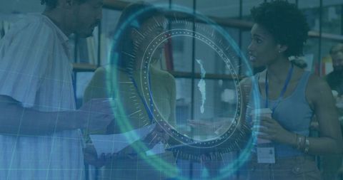 Diverse team collaborating in coworking space with holographic hud, futuristic blue tones
