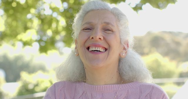 Happy Senior Woman Smiling Outdoors in Sunny Park - Download Free Stock Images Pikwizard.com