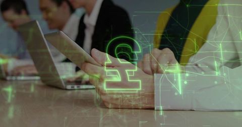 Neon pound symbol with digital workforce in conference room