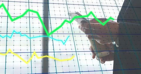 Business professional checking smartphone and holding coffee over financial chart overlay
