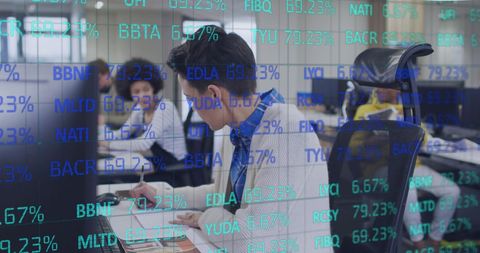 Multicultural Business Team Working with Stock Market Data Overlay