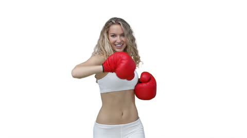 Fit Woman Smiling While Boxing in Red Gloves