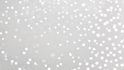 White Bokeh Lights on Gray Background Creating Shimmering Effect