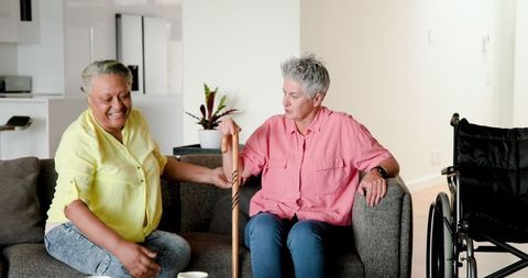 Lesbian senior couple helping with mobility lifestyle