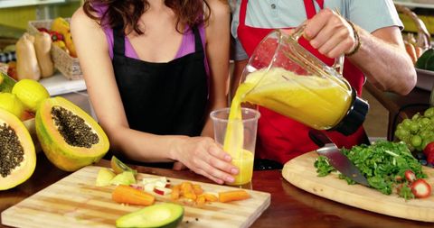 Workers Creating Fresh Juice in Organic Market