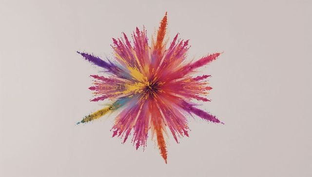 Vibrant multicolor powder explosion on beige canvas