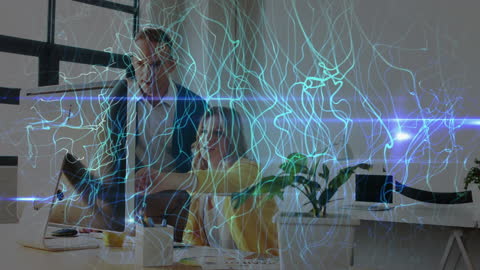 Innovative Teamwork with Futuristic Light Trails in Modern Office