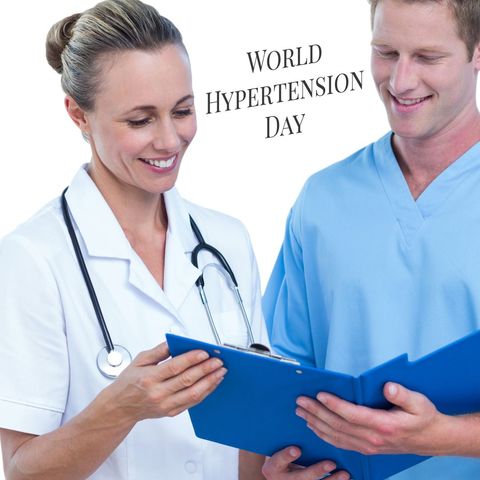 smiling doctors discussing report for world hypertension day - Download Free Stock Templates Pikwizard.com