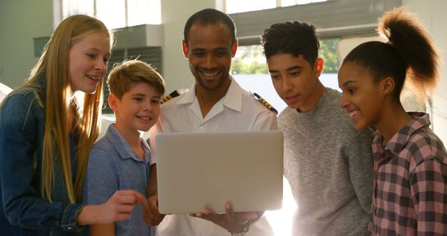 Diverse Group of Students Learning with Instructor Using Laptop - Download Free Stock Images Pikwizard.com