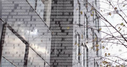 Binary code overlay on modern glass building