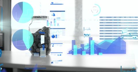 Financial success: coins in jar and digital analytics