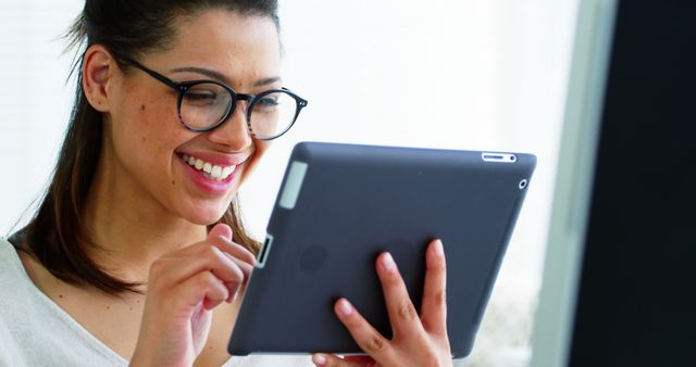 Smiling Woman Using Tablet for Video Call - Download Free Stock Images Pikwizard.com